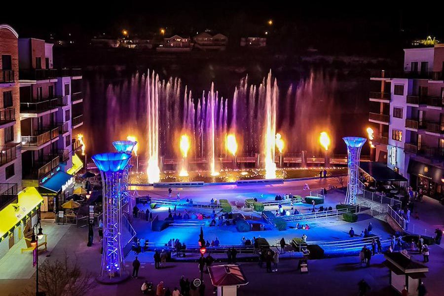 The lit fountain show at Branson Landing after dark