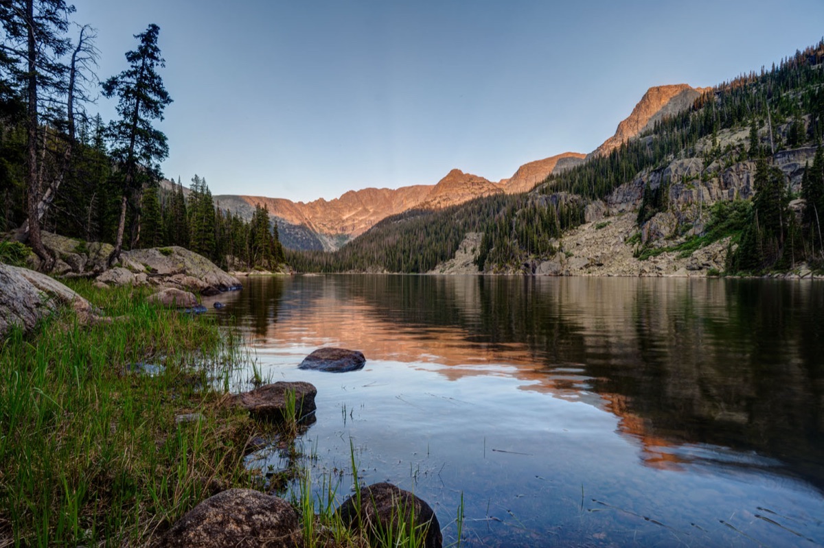 Alpine lake at sunset along the East Inlet Trail
