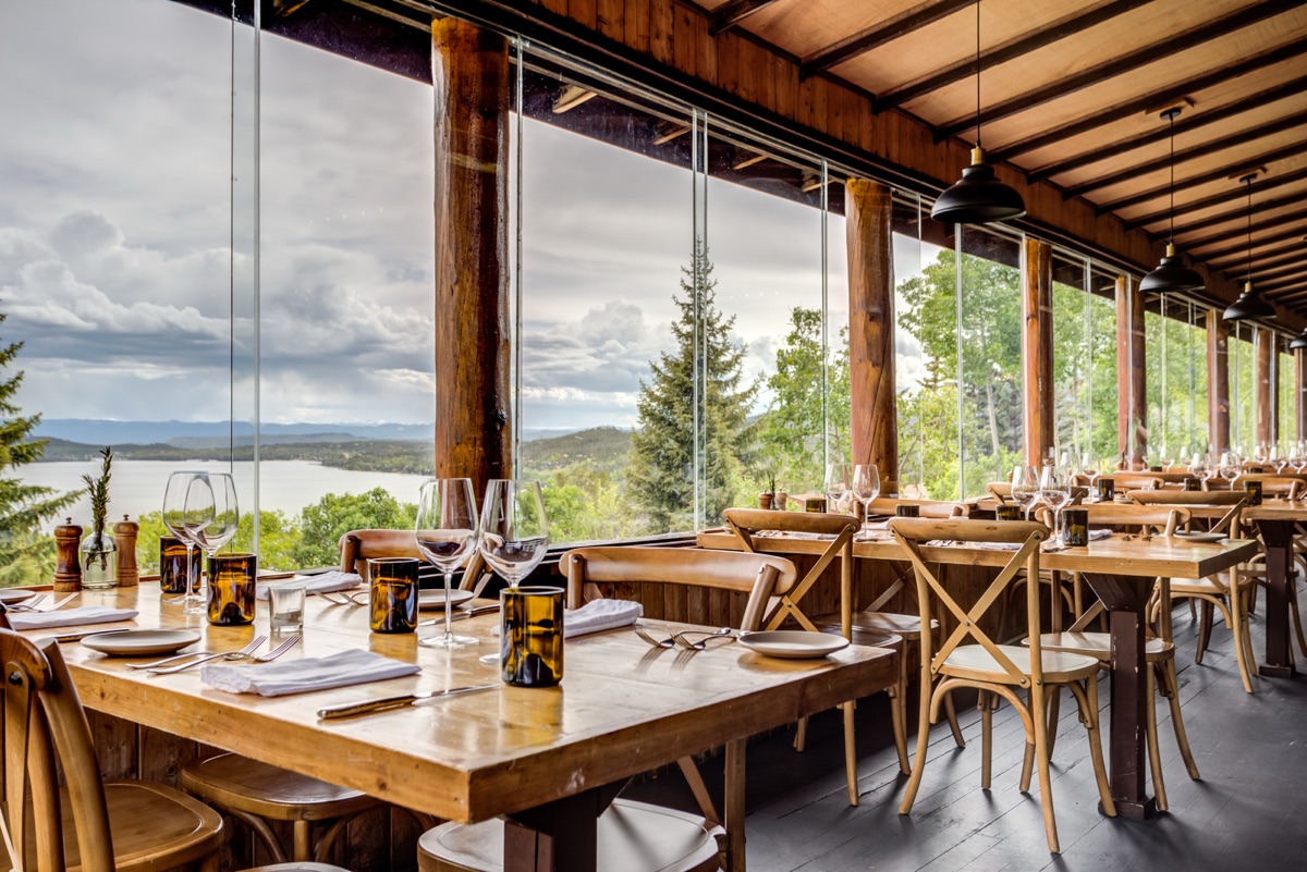 Dining room with forest views at Huntington House Tavern