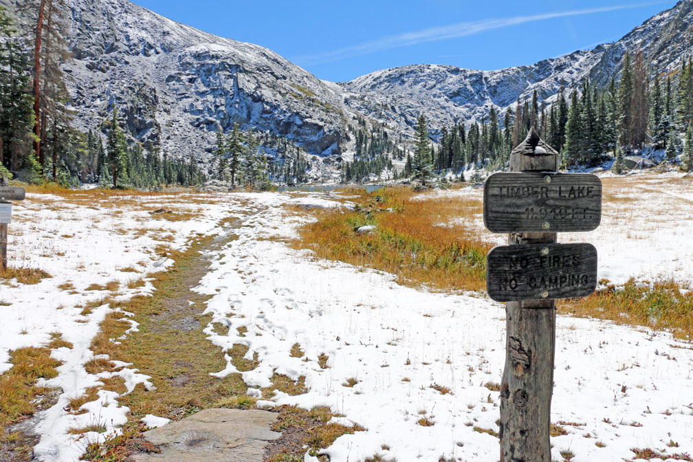 Trail sign on the snowy Timber Lake Trail